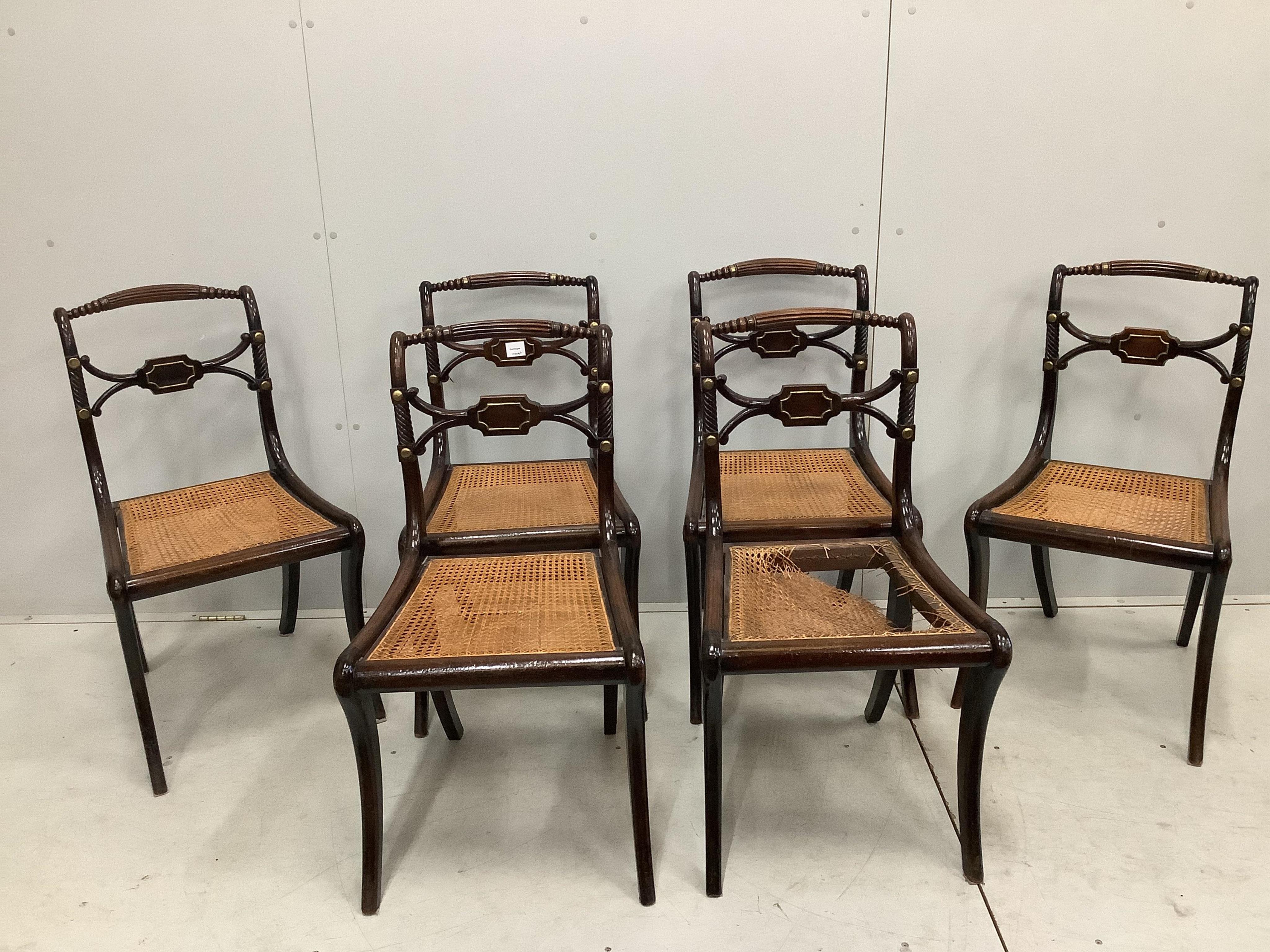 A set of six Regency brass mounted beech cane seat dining chairs